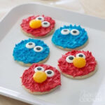 Adorable Sesame Street Elmo and Cookie Monster cookies, perfect DIY treat for kids parties.