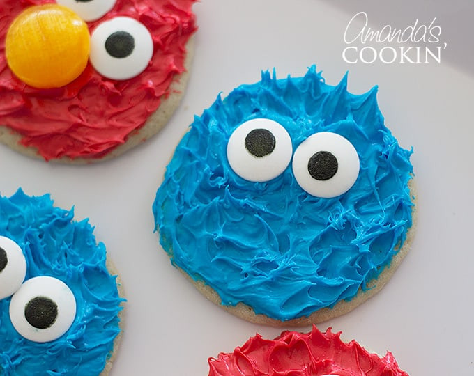 A delightful pair of Cookie Monster and Elmo cookies side-by-side, showing the completed Sesame Street themed treats.