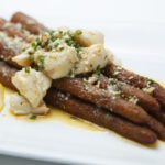 Perry's Signature Fried Asparagus topped with jumbo lump crabmeat at Short Pump Town Center restaurant.