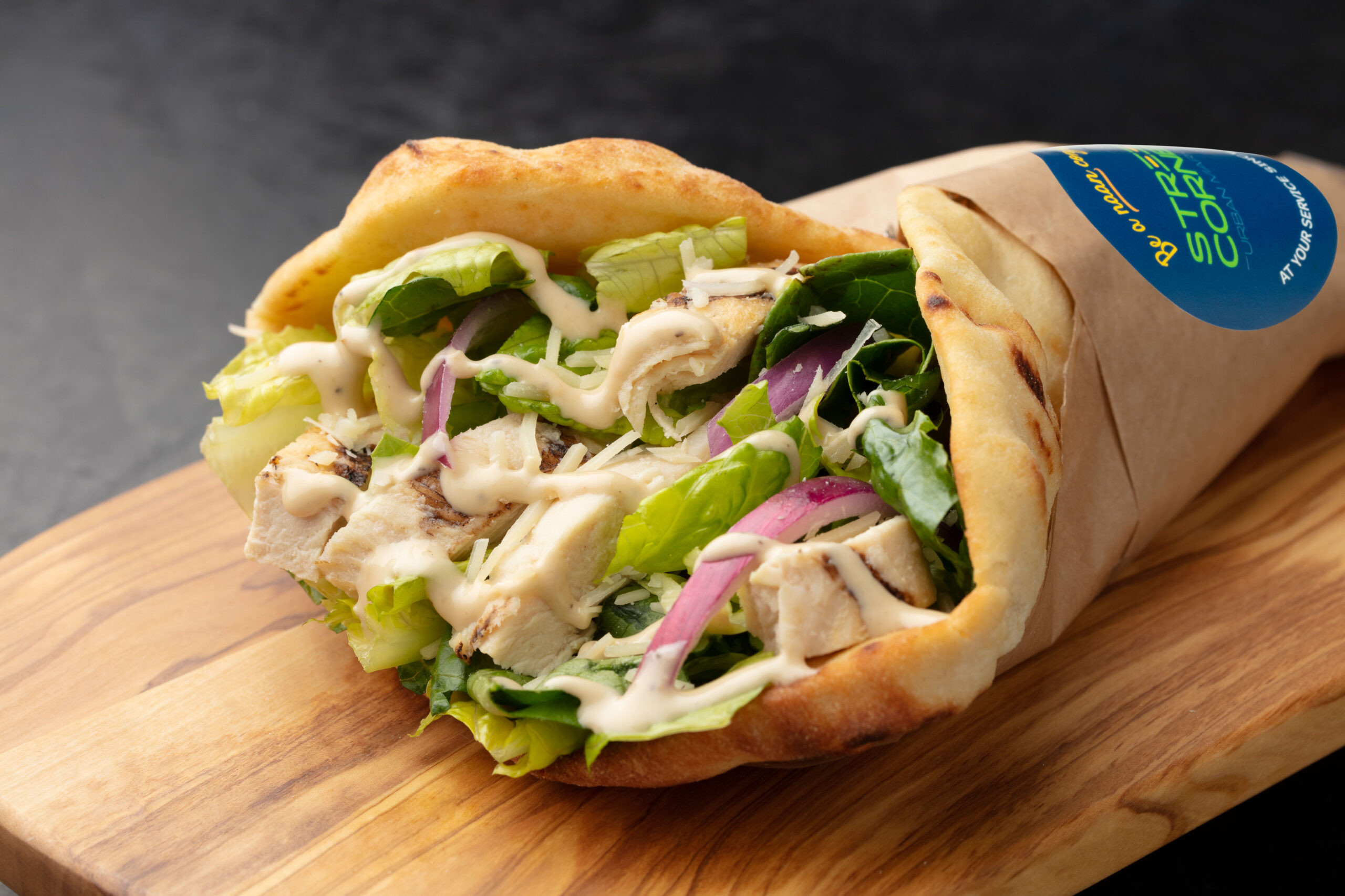 Chicken Caesar Sandwich from Street Corner Fresh Food Service, showcasing the high-quality ingredients and delicious food offerings available at your neighborhood street corner.