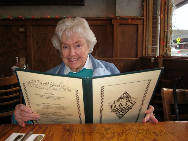 A customer carefully reviewing the menu at First Street Haven in Port Angeles, WA