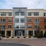 Exterior view of Gables Arsenal Street apartments in Watertown MA, showcasing modern architecture and landscaping