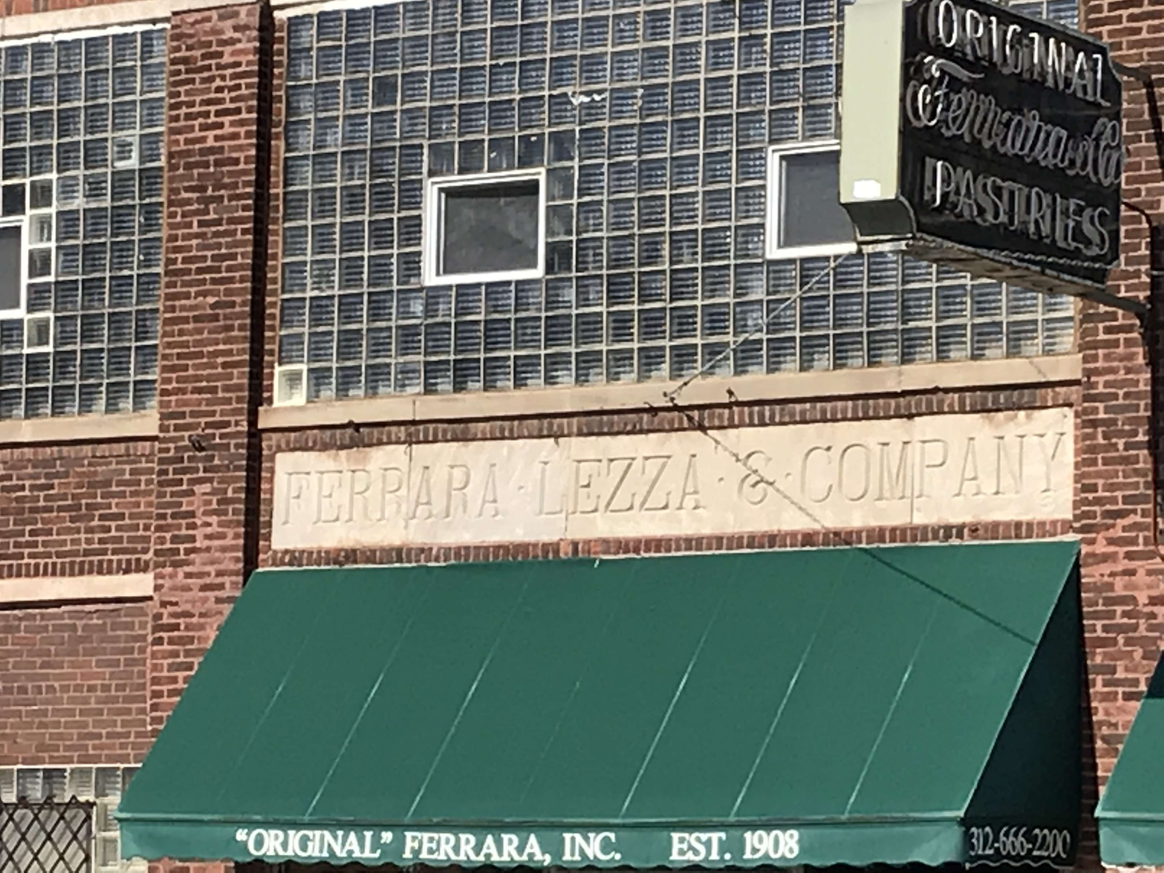 Exterior of Original Ferrara Bakery &amp; Cafe on Taylor Street, a historic Italian bakery in Chicago