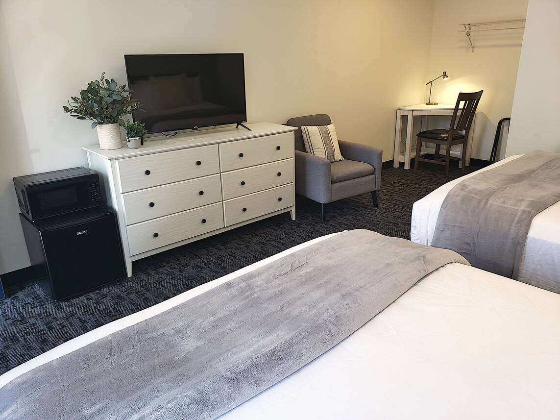 View of the flat screen smart TV in a King Room at Main Street Motel, perfect for evening entertainment.