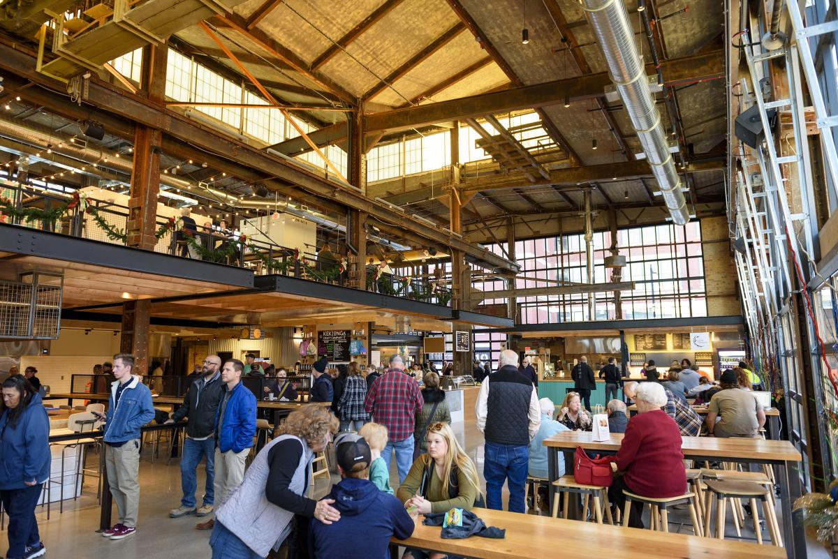 A bustling crowd enjoying food and drinks at Union Street Market in Fort Wayne