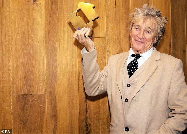 Rod Stewart celebrates the success of his album, Blood Red Roses, which reached Number 1, marking another milestone in his celebrated career
