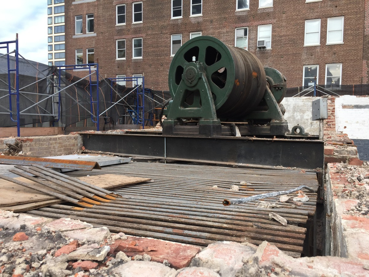 Construction workers on site at 520 West 20th Street, New York, NY, during the building's development phase, showcasing the scale of the project.