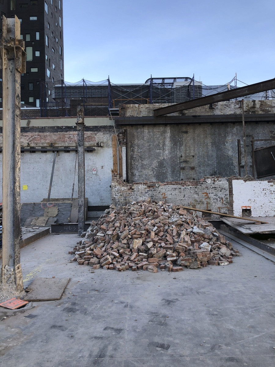 Close-up of the steel framework being erected for the modern addition at 520 West 20th Street, New York, NY, illustrating the structural complexity of the design.