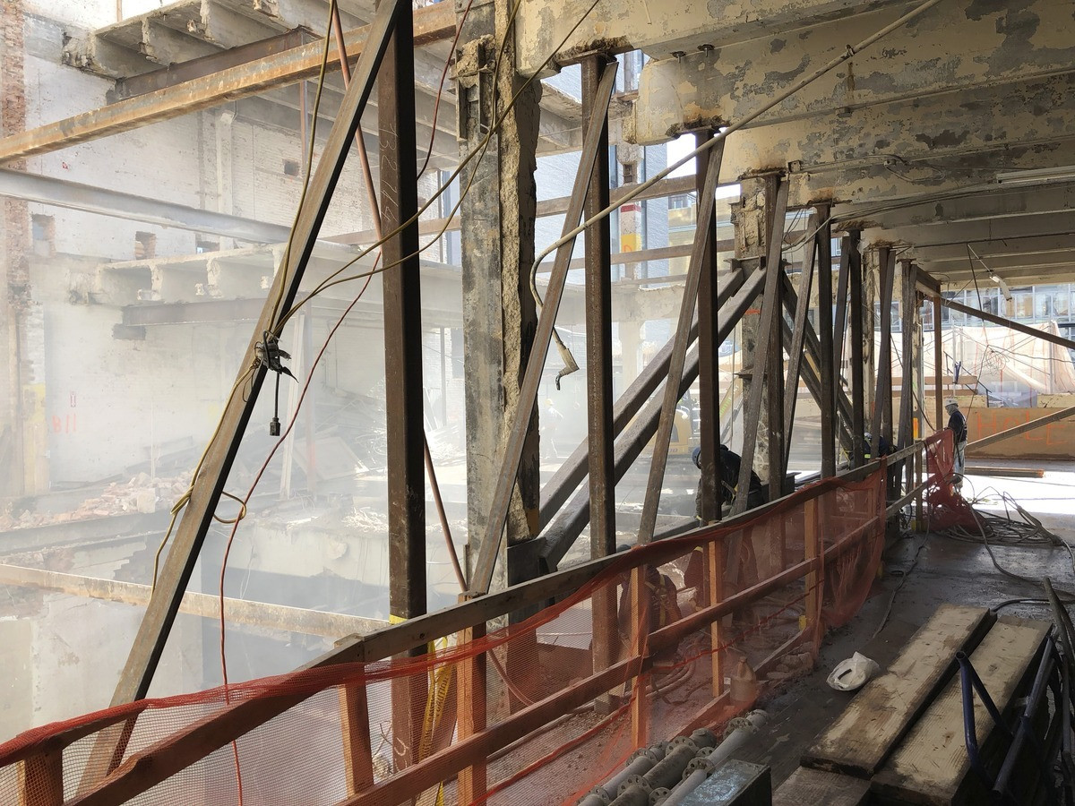 Steel beams being installed during the construction of 520 West 20th Street, New York, NY, emphasizing the modern architectural techniques used.