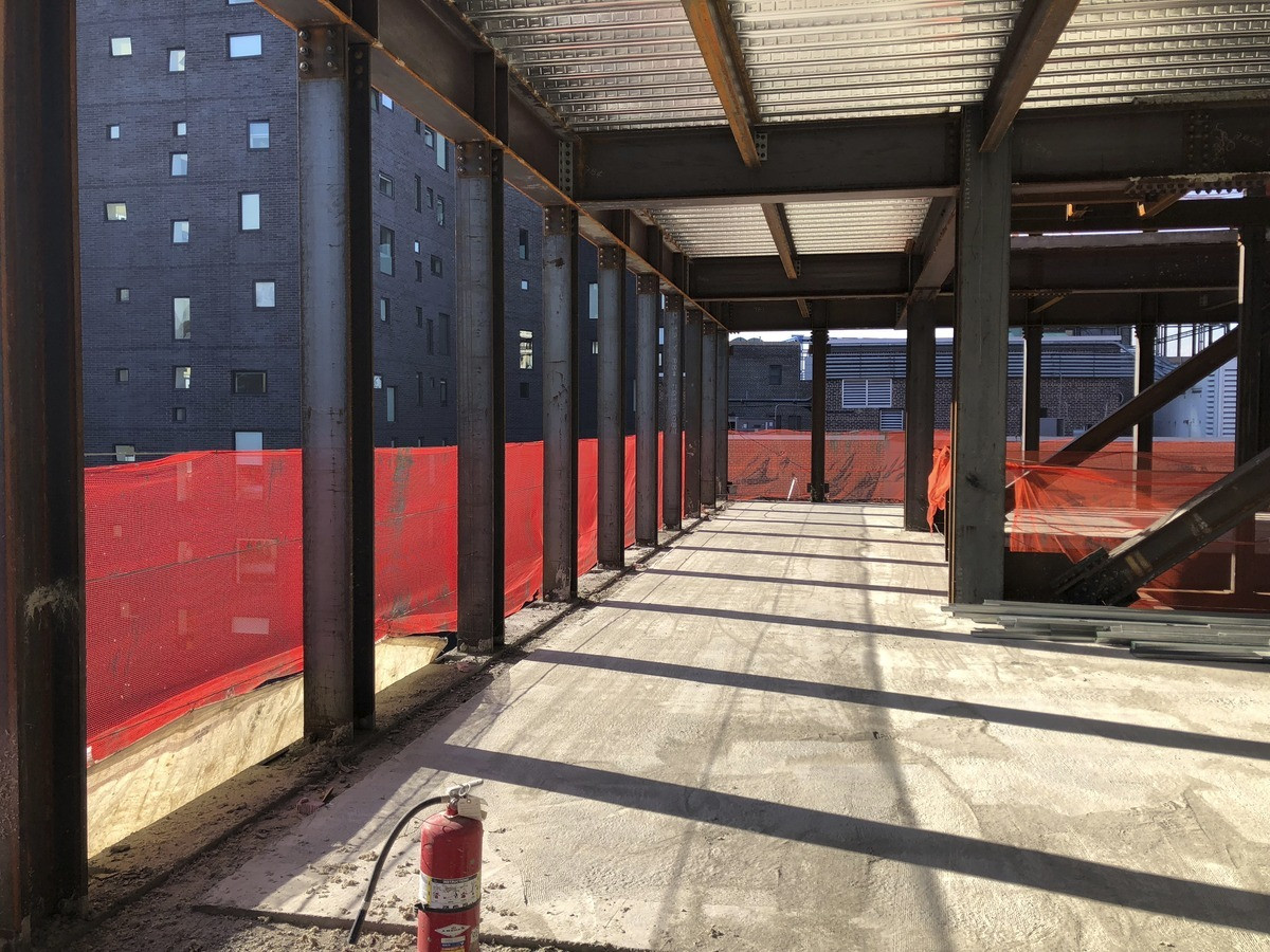 Overview of the construction activity at 520 West 20th Street, New York, NY, showing the various stages of building and preservation.