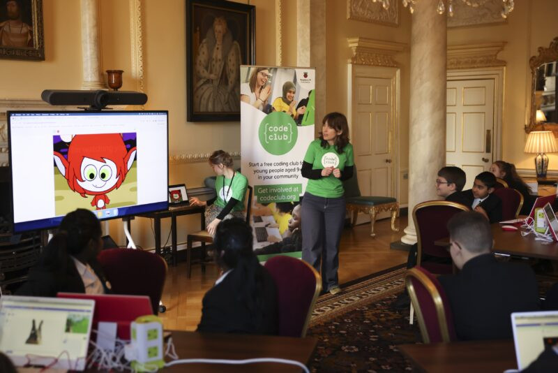 Enthusiastic students participate in a Code Club workshop inside 10 Downing Street, exploring coding projects.