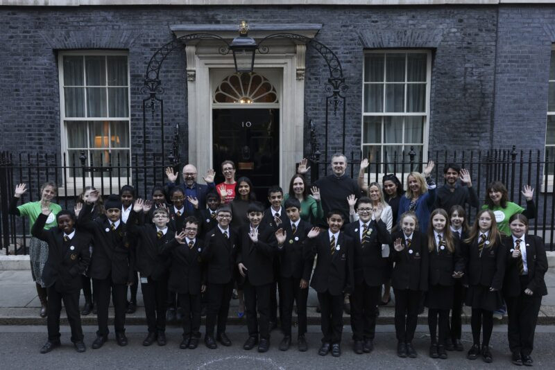 Code Club participants pose in front of the iconic 10 Downing Street, celebrating their coding experience.