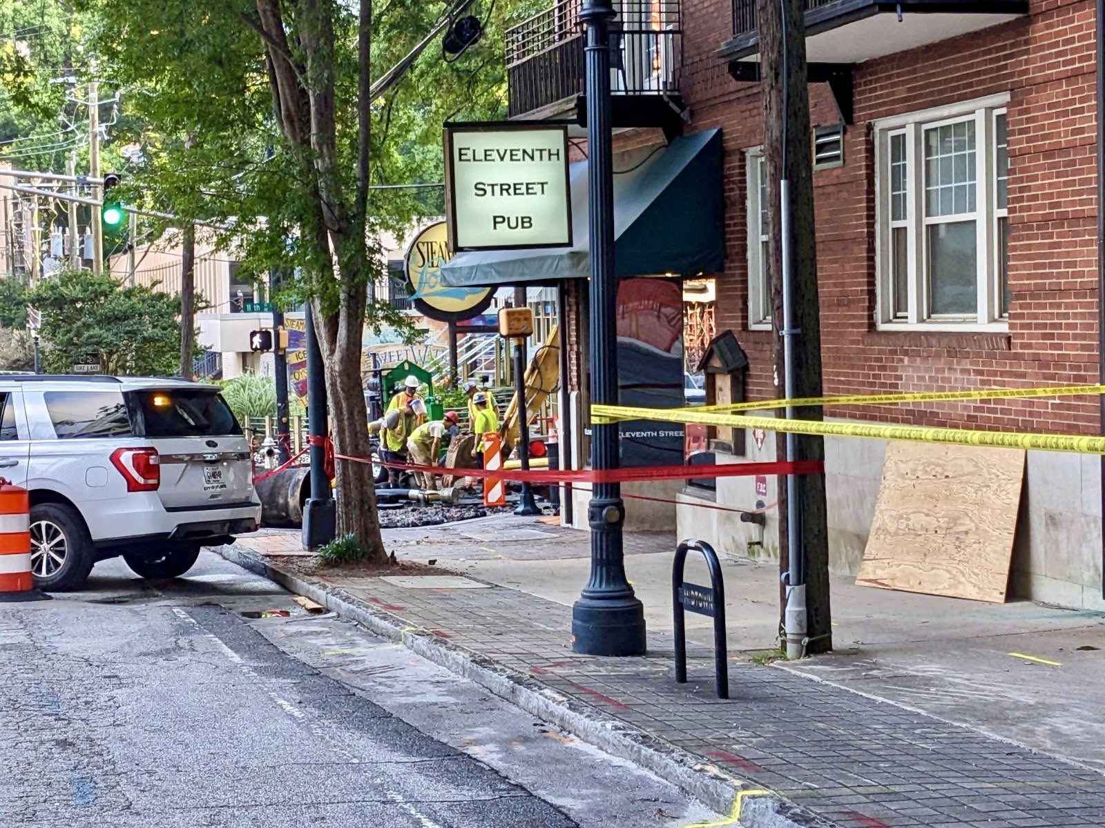 City crews work diligently to repair the 11th Street water main break affecting Eleventh Street Pub Atlanta and surrounding Midtown.