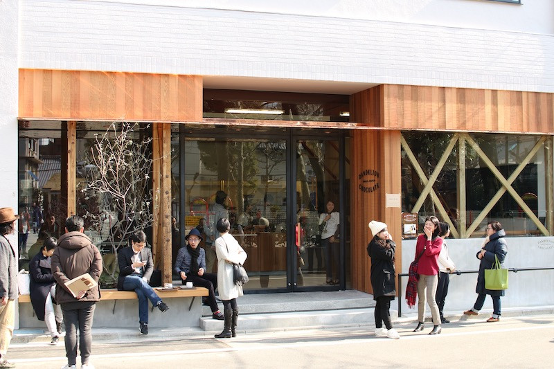 Guests enjoy the ambiance outside Dandelion Chocolate's Kuramae cafe in Tokyo
