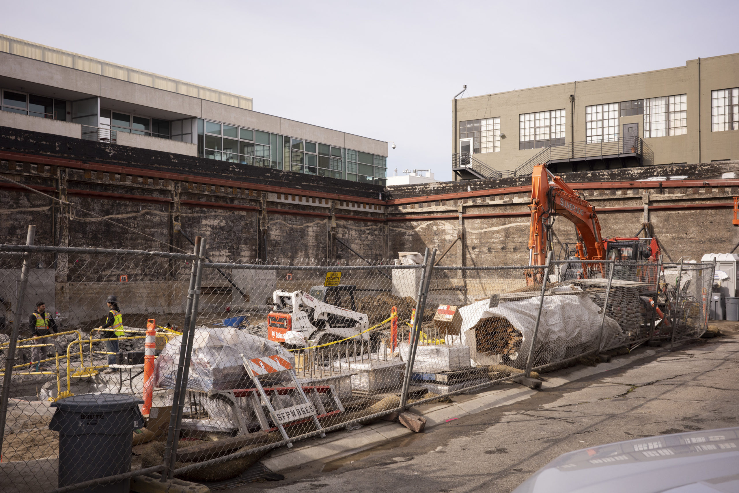 Construction site of 828 Brannan Street, showing cleared land and proximity to neighboring buildings.
