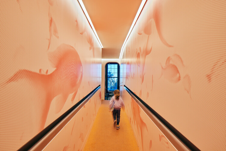 Open and airy interior of Adams Street Library, designed by WORKac to foster community engagement.