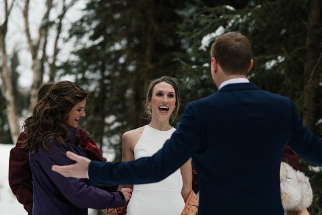 Groom's surprised reaction to the bride's T-Rex costume during their first look at King Street Brewing