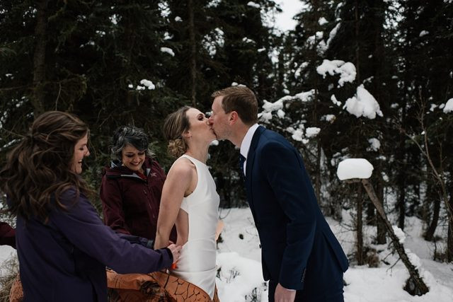 Bride and groom laughing during their unforgettable T-Rex first look at Anchorage brewery wedding