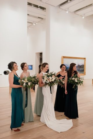 Candid shot of bride and groom in Anchorage Museum, capturing intimate wedding moments