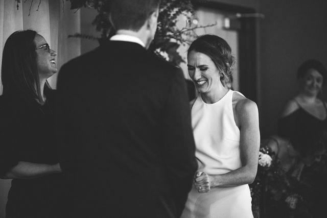 Joyful wedding reception scene at King Street Brewing in Anchorage, Alaska