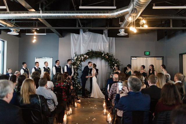 Candid wedding photograph at King Street Brewing, capturing reception celebrations in Anchorage