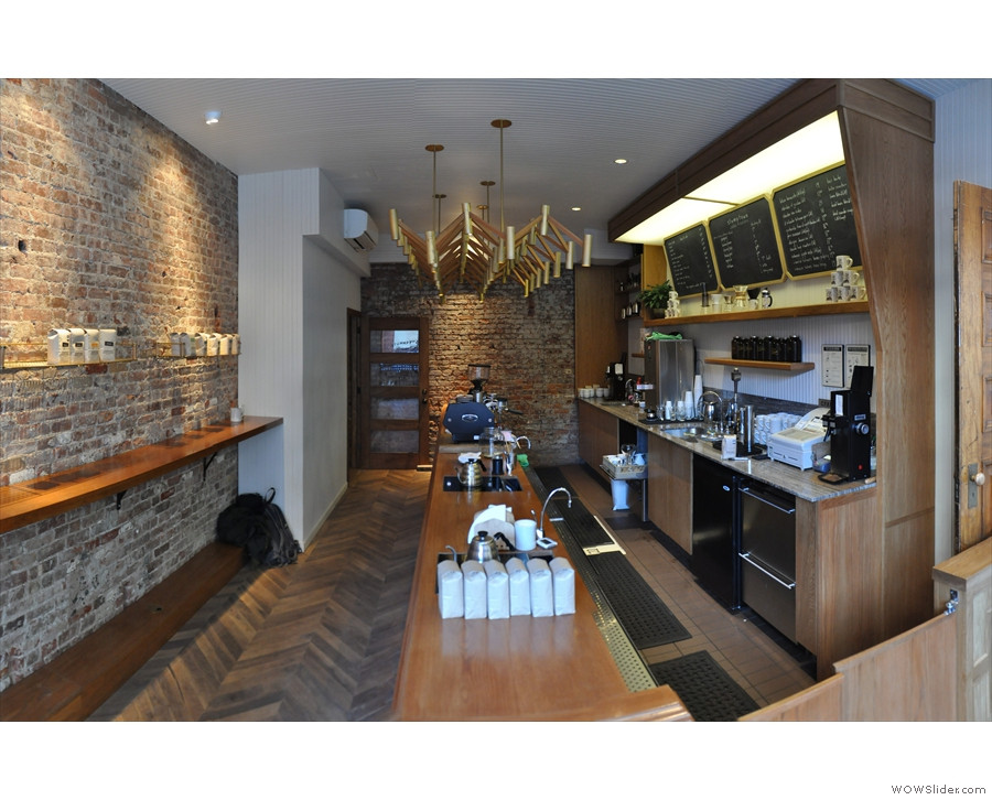 Interior of the brew bar at Stumptown West 8th Street, showing the stand-up bar, brew equipment, and connection to the espresso bar.
