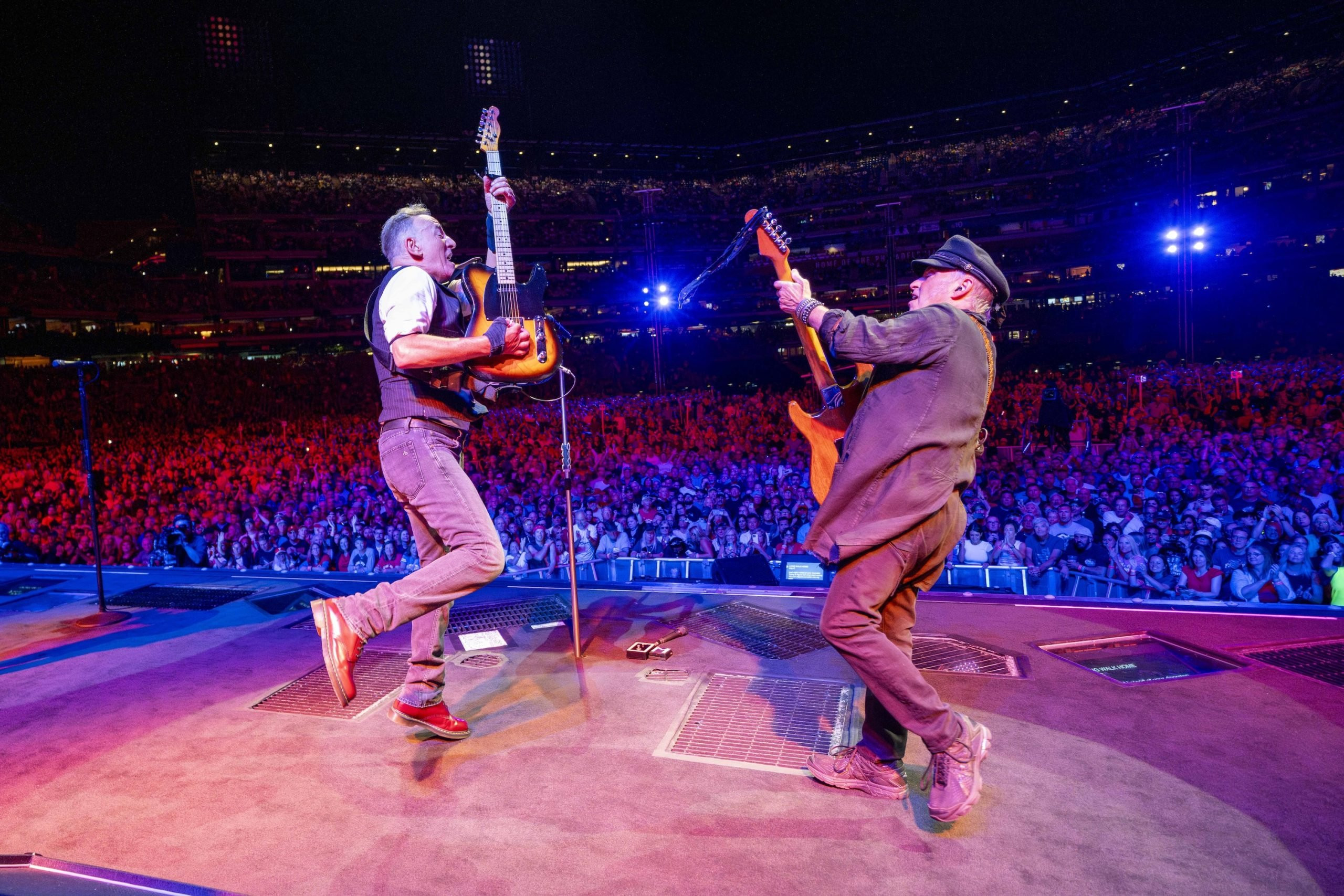 Close-up shot of Bruce Springsteen singing passionately at the Philadelphia concert.