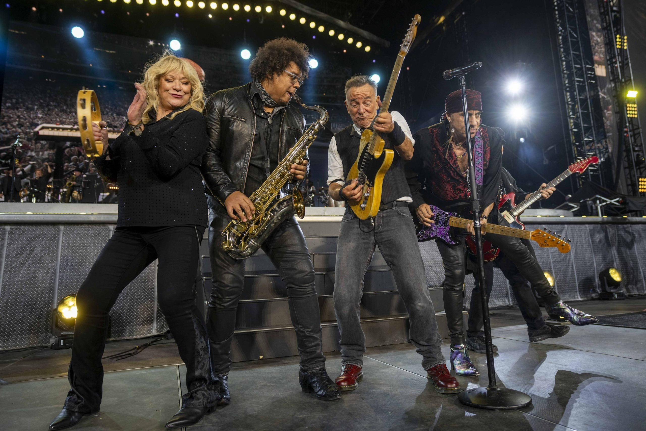 Bruce Springsteen playing guitar and singing with the E Street Band in Philadelphia.