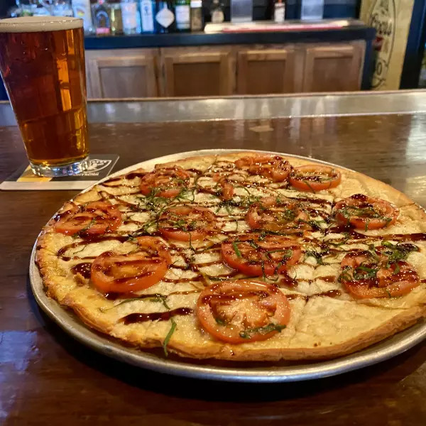 Ricca's Bruschetta Flatbread topped with fresh basil and balsamic glaze