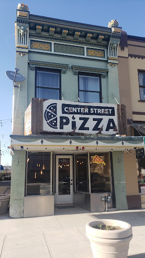 Center Street Pizza storefront in downtown Logan, Utah, inviting diners for a taste of local pizza.