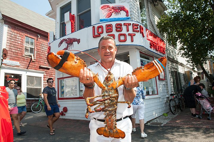 Shawn McNulty, co-owner of The Lobster Pot restaurant, showcasing the fresh seafood on Commercial Street, Provincetown.