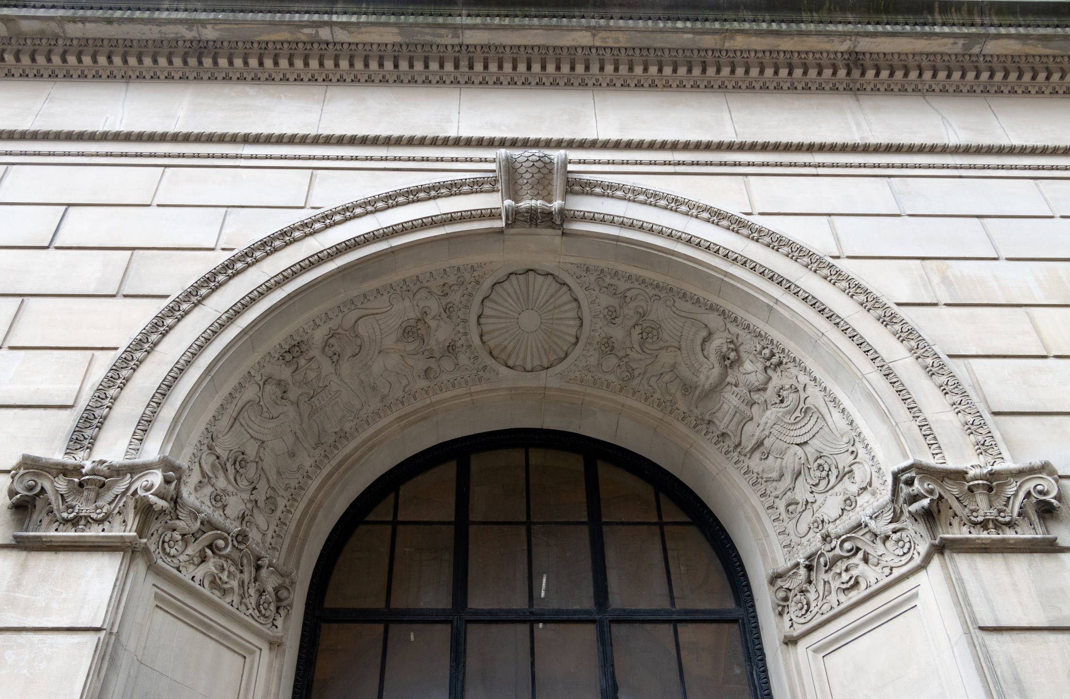 Gryphon ornamentation above a doorway at 345 Adams Street, showcasing the architectural detail of the Brooklyn Edison Building.