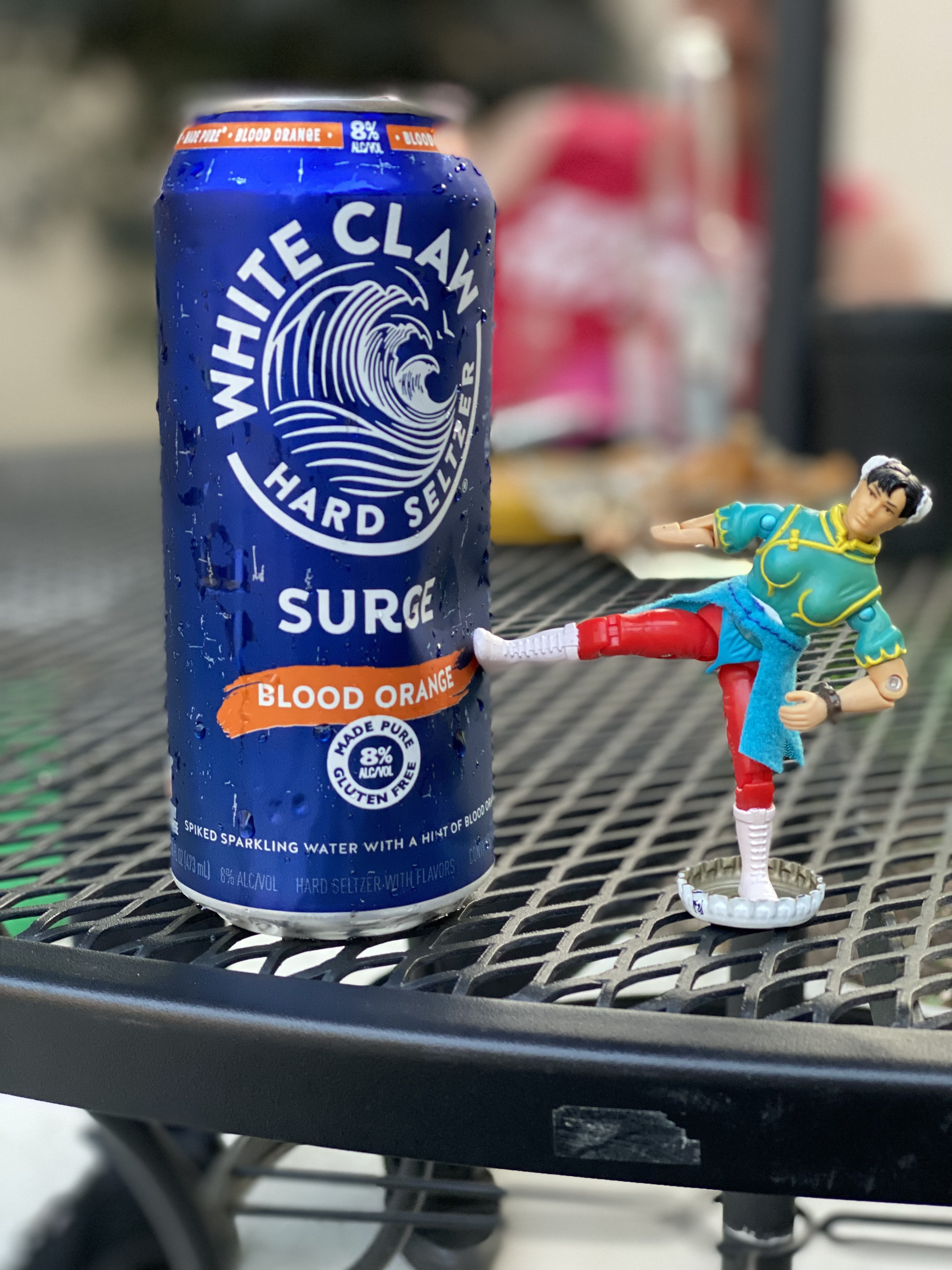 Chun-Li action figure from the 1994 Street Fighter movie toy line posed on a wooden deck, photographed by Kyle.