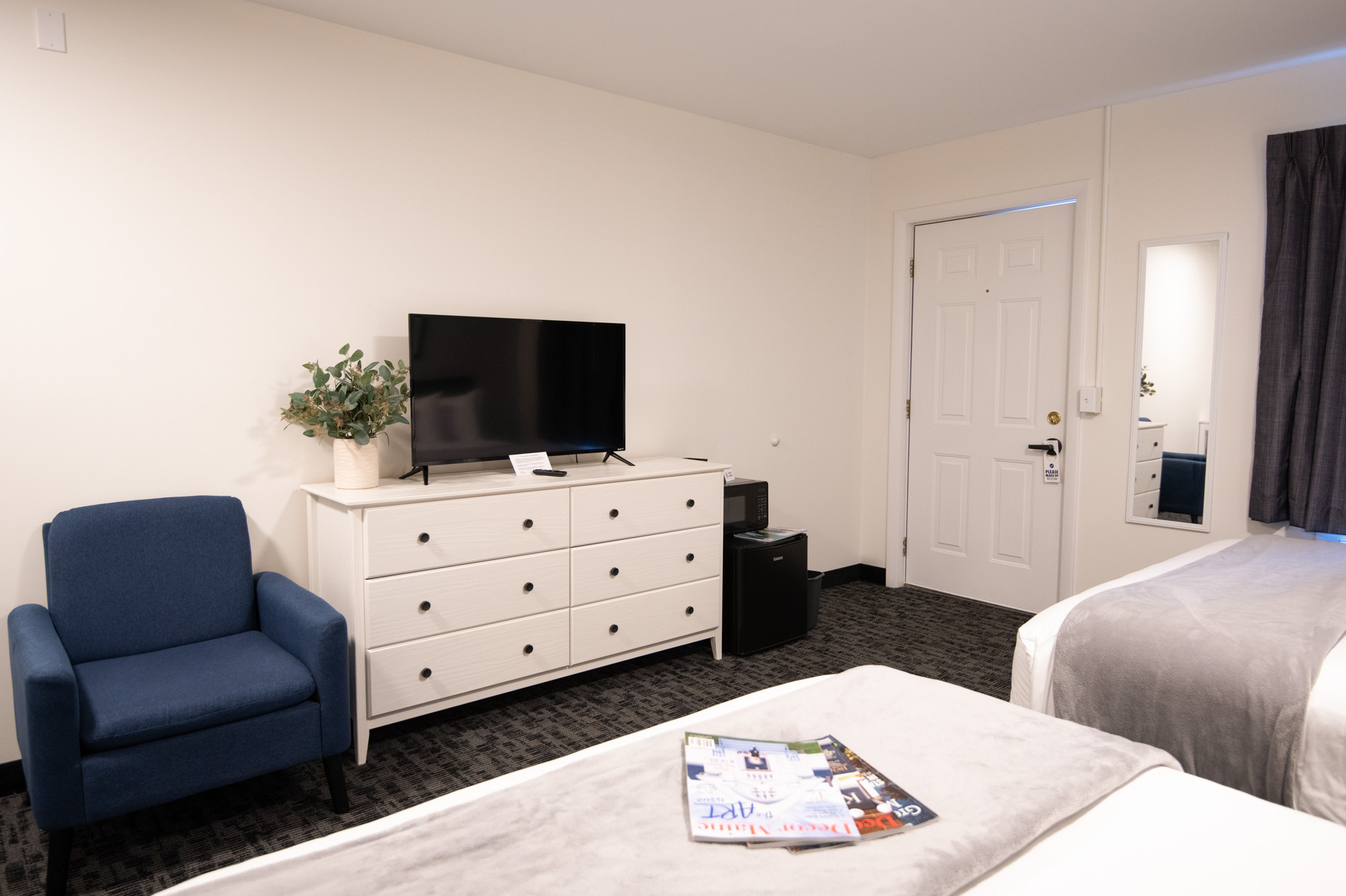 Spacious King bed in a renovated room at Main Street Motel, promising a restful night's sleep in Bar Harbor.