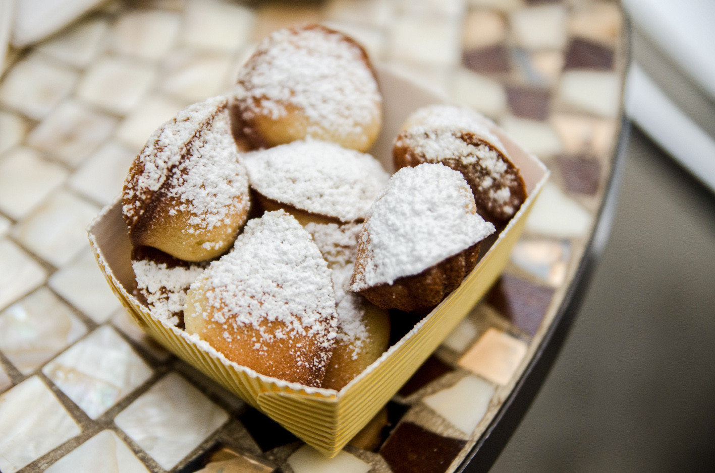 Large, flaky Pain au Chocolat pastry from Dominique Ansel Bakery, showcasing airy layers