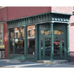 Exterior view of Stumptown Coffee on West 8th Street at the corner of MacDougal Street, showcasing its corner location and entrance to the espresso bar.