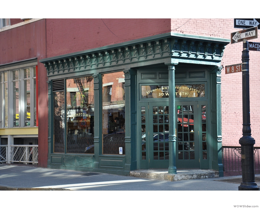 Exterior view of Stumptown Coffee on West 8th Street at the corner of MacDougal Street, showcasing its corner location and entrance to the espresso bar.