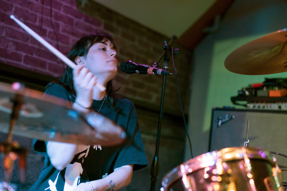 Close-up photo of Hello Mary's guitarist at Bond Street Bar, highlighting the band's engaging stage presence during their Asbury Park show.