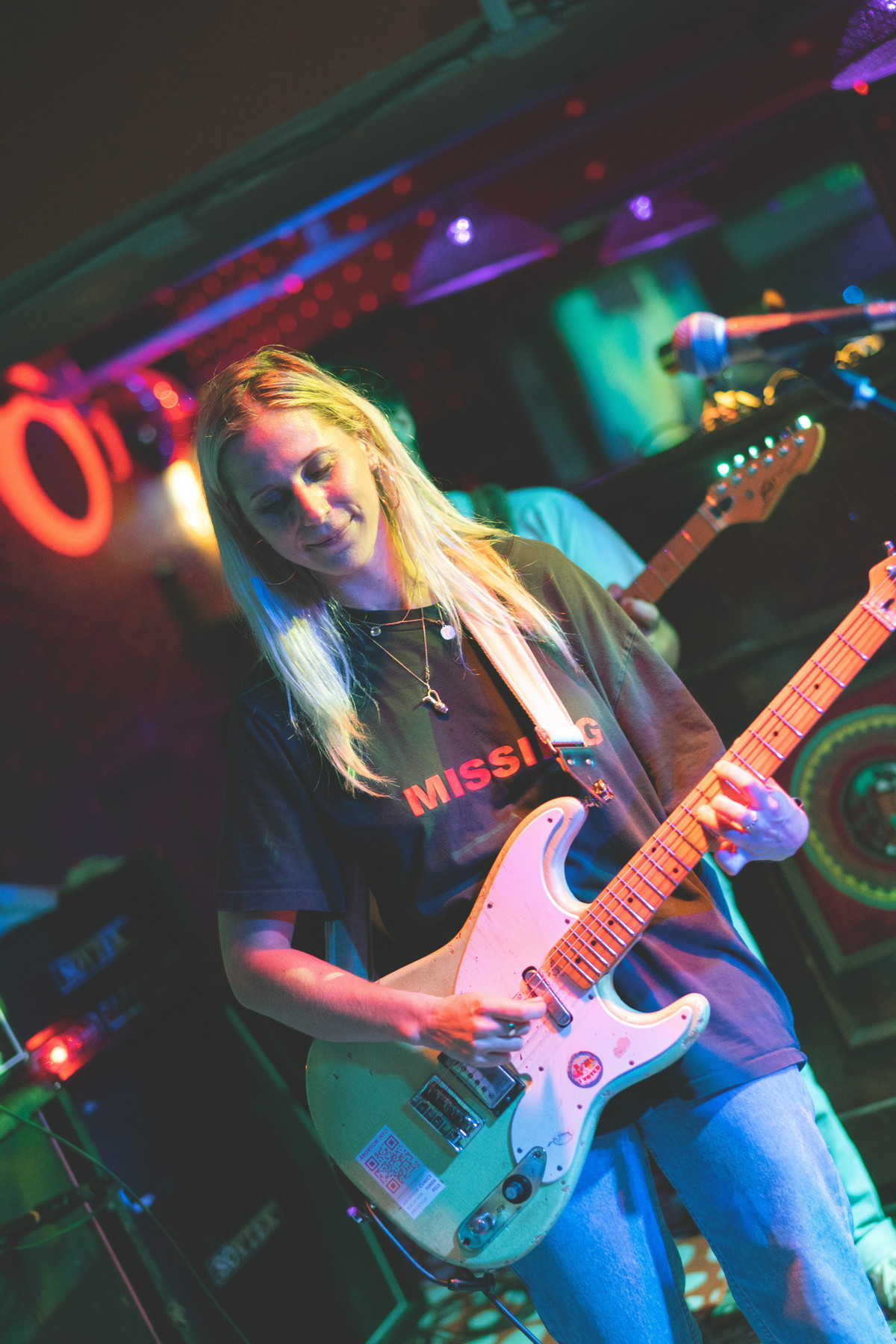 Close-up of Alicia Bognanno singing intensely at Bond Street Bar, emphasizing the raw emotion and vocal power of Bully's performance.