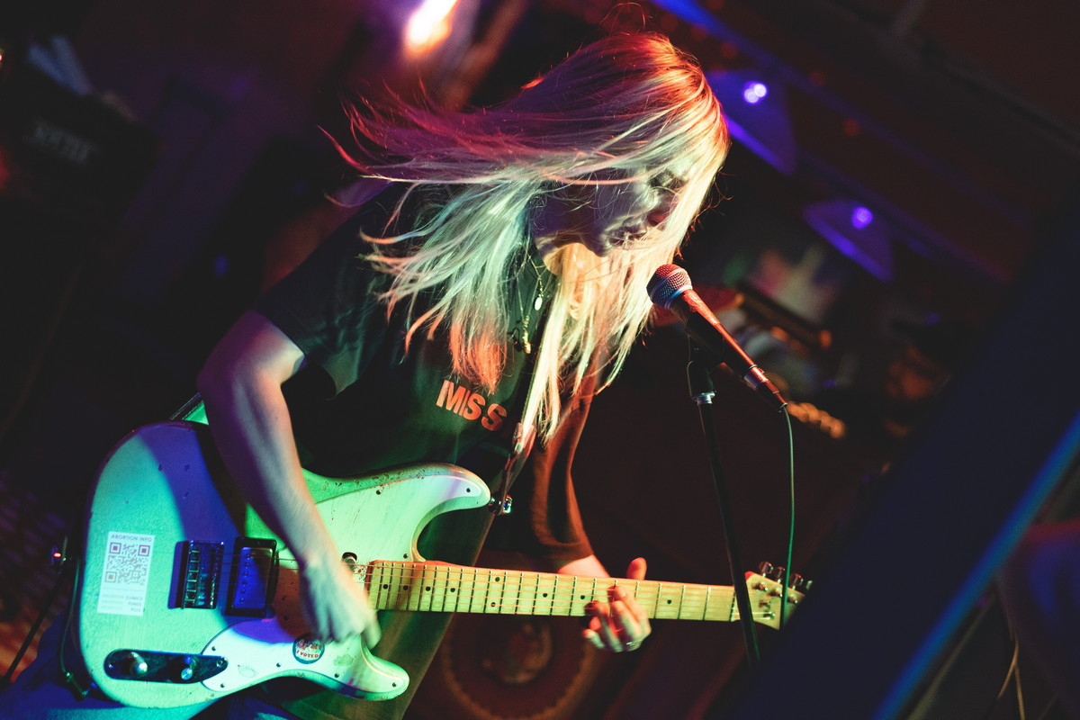 Live music scene at Bond Street Bar featuring Bully, capturing the vibrant energy and audience interaction during the concert.