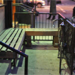 Benches outside Ninth Street Espresso on 9th Street, inviting customers to relax and enjoy their coffee in Alphabet City.