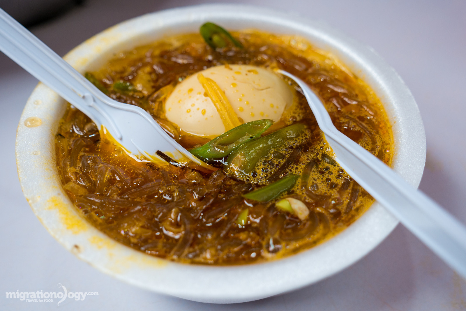 Sotanghon, Filipino cellophane noodles in broth, a comforting street food option.