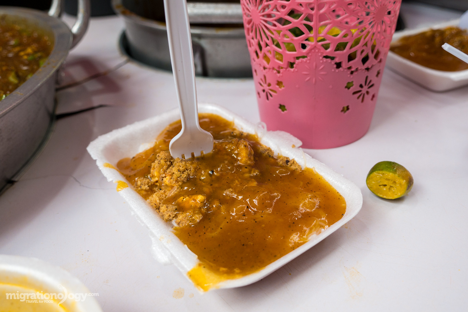 Filipino noodle dish Palabok, a popular street food snack often found in markets like Quiapo Market.