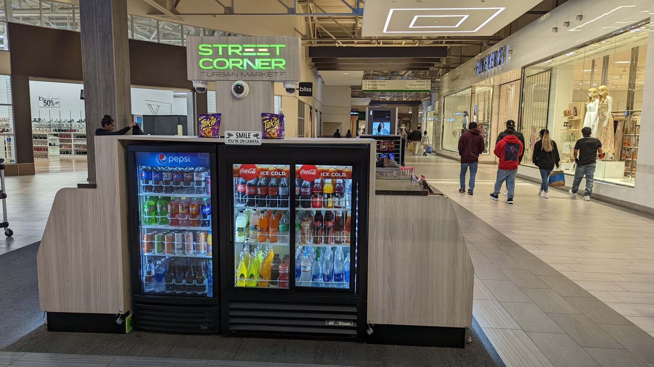 Cooler selections at a Street Corner Express kiosk in Great Mall at the Bay, highlighting the grab-and-go beverage options at this convenient street corner location.