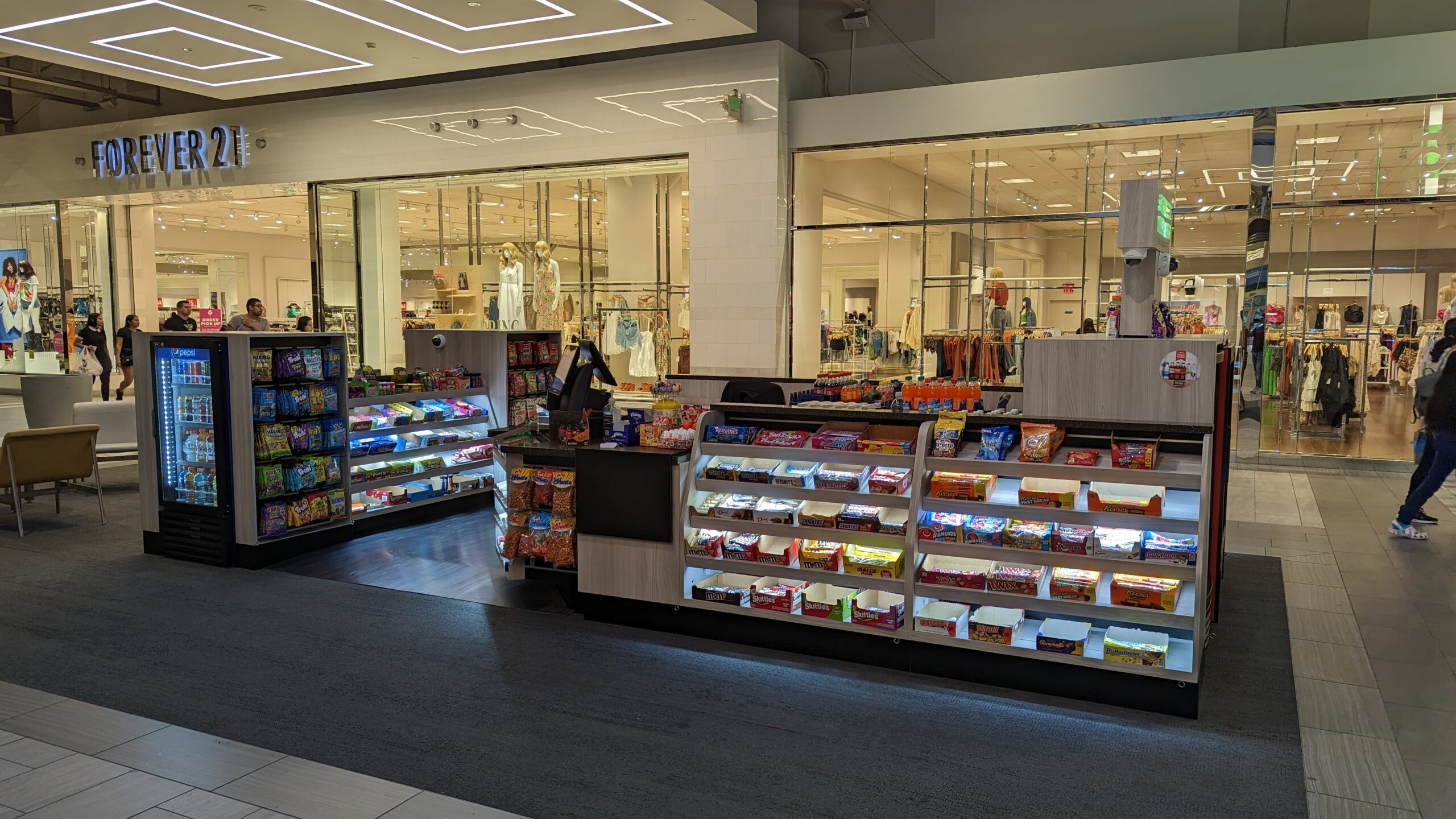 Street Corner Express kiosk at Great Mall at the Bay, positioned in front of Forever 21, showcasing high visibility and strategic placement within a busy shopping center street corner.