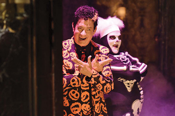 Tom Hanks in a still from SNL's Haunted Elevator sketch, reacting to bizarre and humorous scenarios.