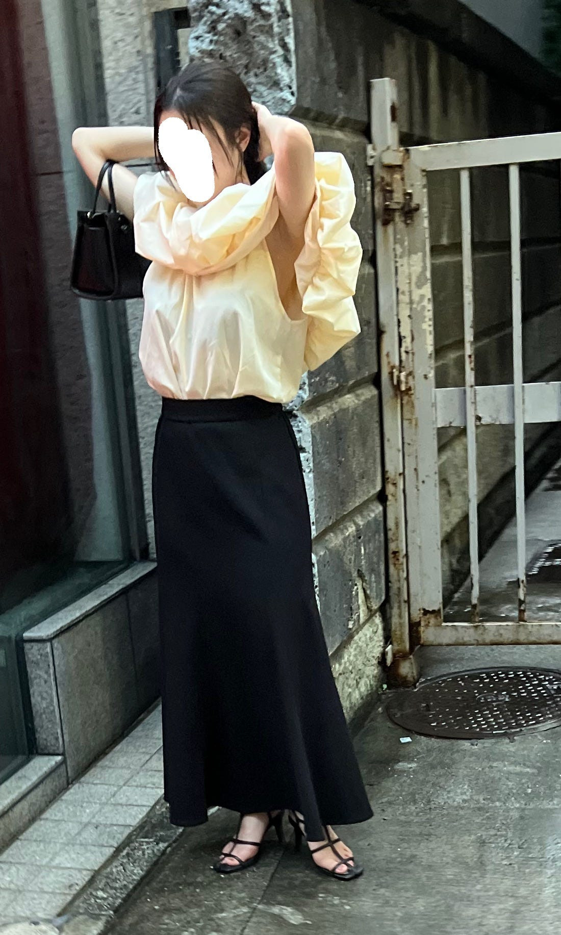 Street fashion photograph of a person in a stylish and practical backpack, highlighting the importance of accessories in Japanese street fashion.