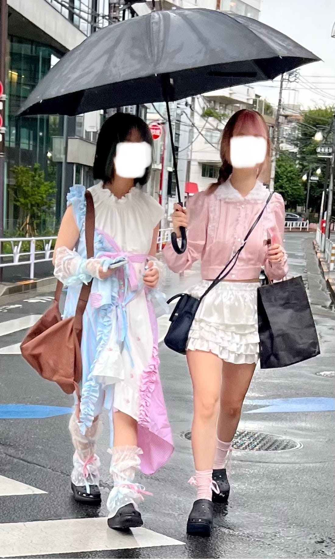 Street fashion photograph of a person in a lolita-style dress, showcasing the enduring influence of Japanese alternative fashion subcultures.
