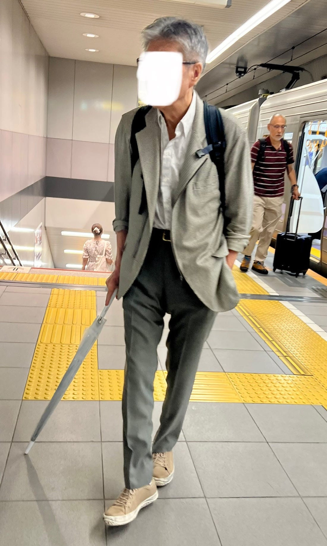 Street style image of a person in a casual yet fashionable denim-on-denim outfit, demonstrating the timeless appeal of denim in Japanese street fashion.