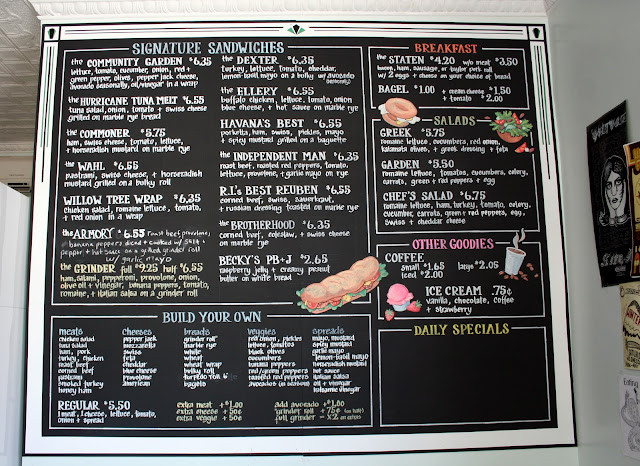 Hudson Street Deli menu board featuring locally designed graphics